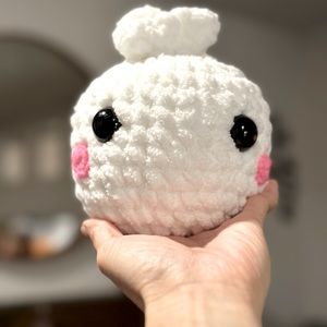 A cute stuffed toy that resembles a Bao buns.